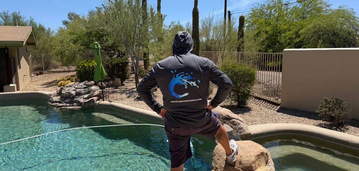 McCool's Pools technician with beautiful Arizona pool